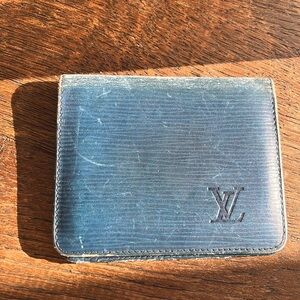 Louis Vuitton blue epi bifold wallet. Tired but still cute